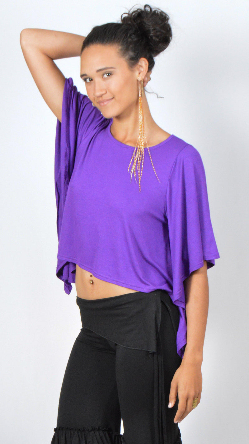 Girl wearing Umba's purple Butterfly Sleeve Top with black gypsy, ruffled pirate short pants, front side view, festival fun, sold at Umba Love in Boulder, CO