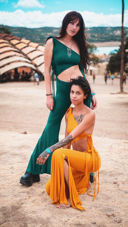 Two girls wearing jade and gold Umba Love gypsy skirt pants as a onesie at LIB music festival.